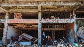 Two women in the ruins of a building in Marawi City, Philippines.